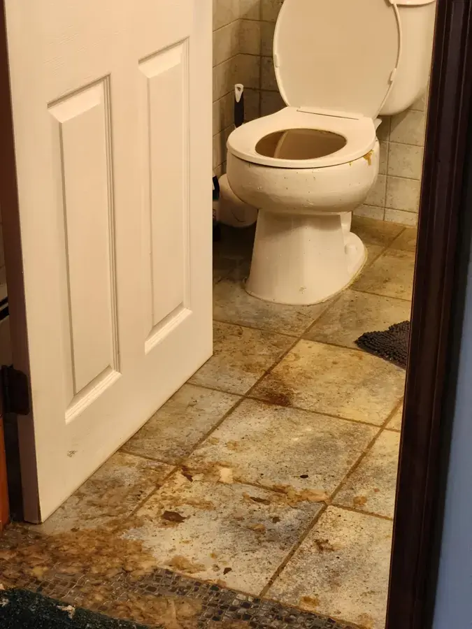Sewage backup from a toilet spread across a bathroom floor in Sammamish, WA